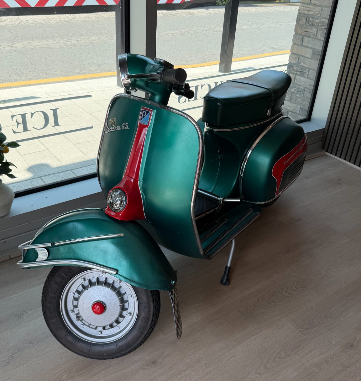 1960s green Vespa GS in the dining room